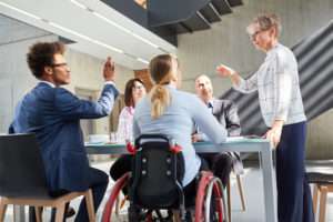 Business team having a discussion in a meeting for inclusion and diversity