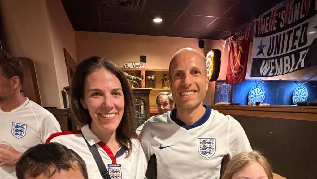 Erin and spouse wearing England football shirts